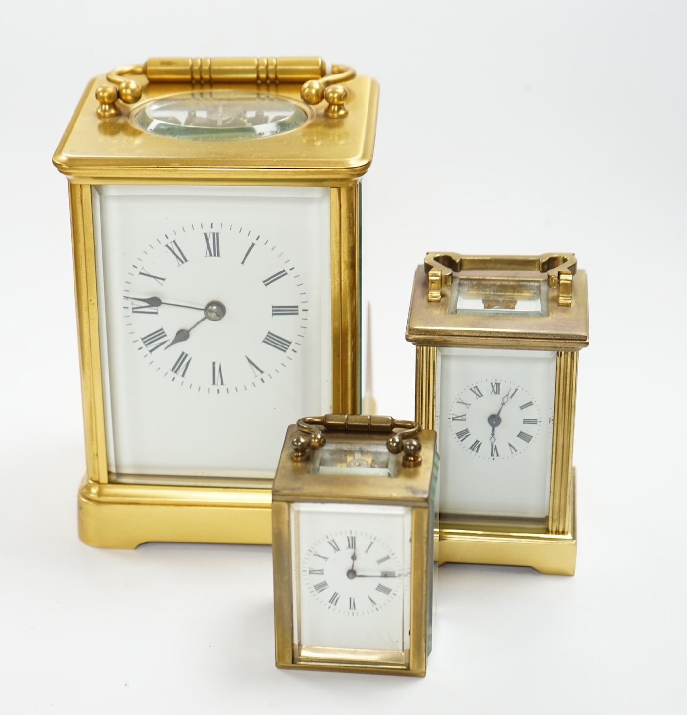 A French carriage clock and two other miniature carriage clocks, largest 13cm high. Condition - fair to good, not tested as working